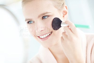 Buy stock photo Woman, beauty and cosmetics with makeup brush, blush and confidence for dermatology or healthy skin in home. Female person, pride and wellness with smile, glow and results in skincare or cosmetology