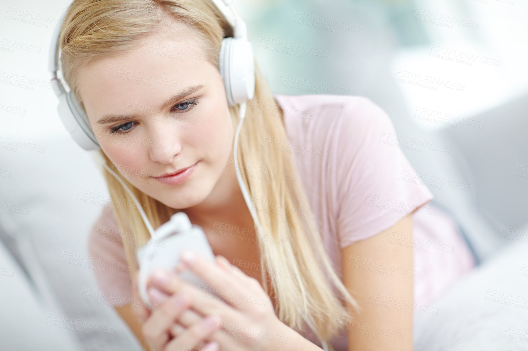 Buy stock photo Headphones, relax and woman in home listening to music, song or radio on sofa in living room. Calm, cellphone and female freelance playlist curator with audio tech for online album review at house.