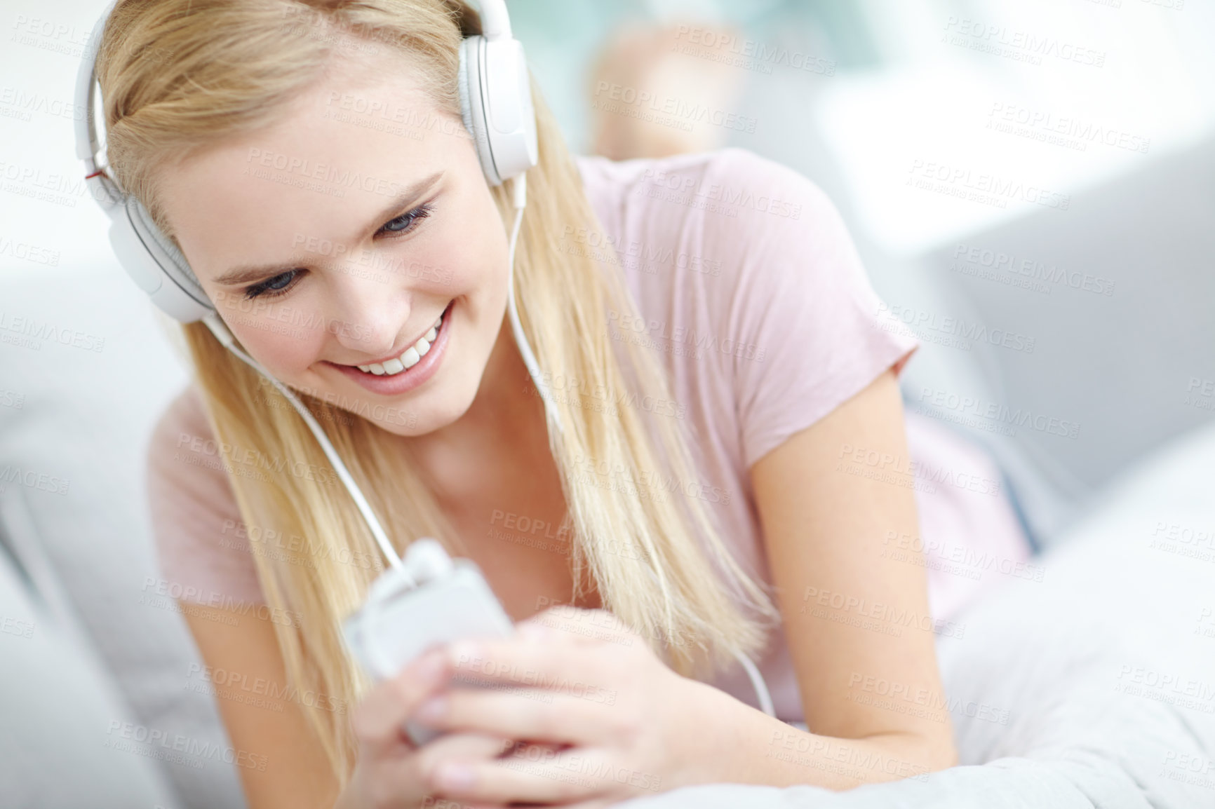 Buy stock photo Headphones, happy and woman in home listening to music, song or radio on sofa in living room. Relax, cellphone and female freelance playlist curator with audio tech for online album review at house.