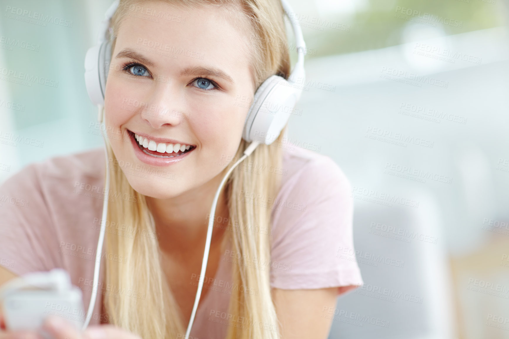 Buy stock photo Headphones, relax and woman in home streaming to music, song or radio on sofa in living room. Smile, cellphone and female freelance playlist curator with audio tech for online album review at house.