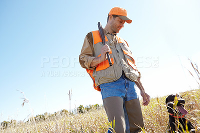 Buy stock photo Man, dog and bush for hunting prey, stalking and search for game together in nature. Mature person, pet animal and hunter helper in field to guide in woods, partnership and tracking in outdoor mockup