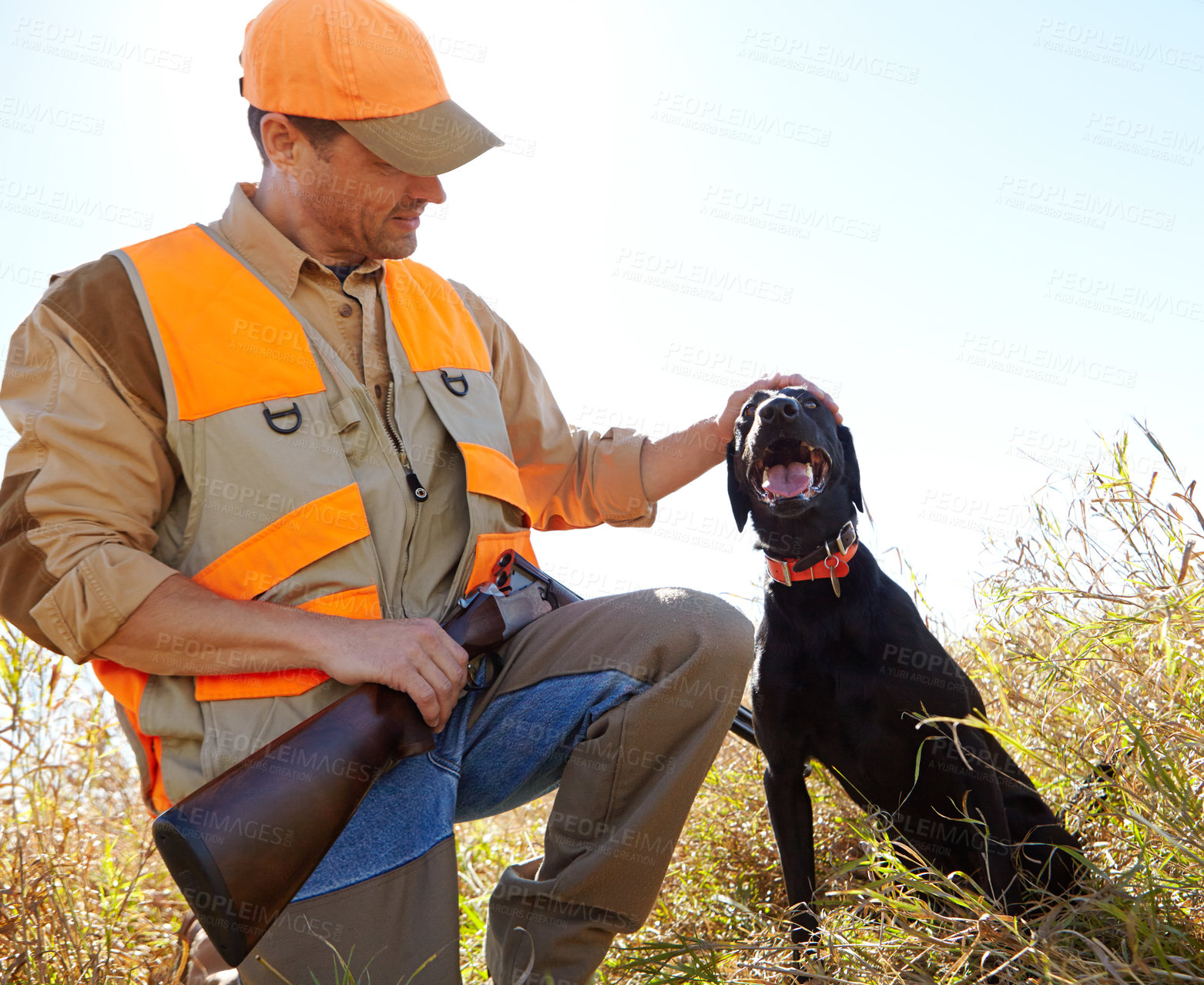 Buy stock photo Man, touch dog and outdoor for hunting season, stroke and search for prey together in nature. Mature person, pet animal and hunter helper in field to guide in woods, affection and tracking in sports