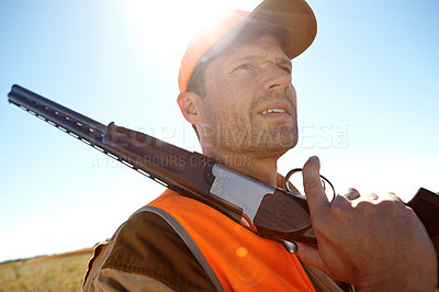 Buy stock photo Man, gear and outdoor nature for hunting, thinking and stalking prey adventure in bush. Mature person, shotgun and hunter planning in field for shooting games, sun flare and tracking rifle in sports