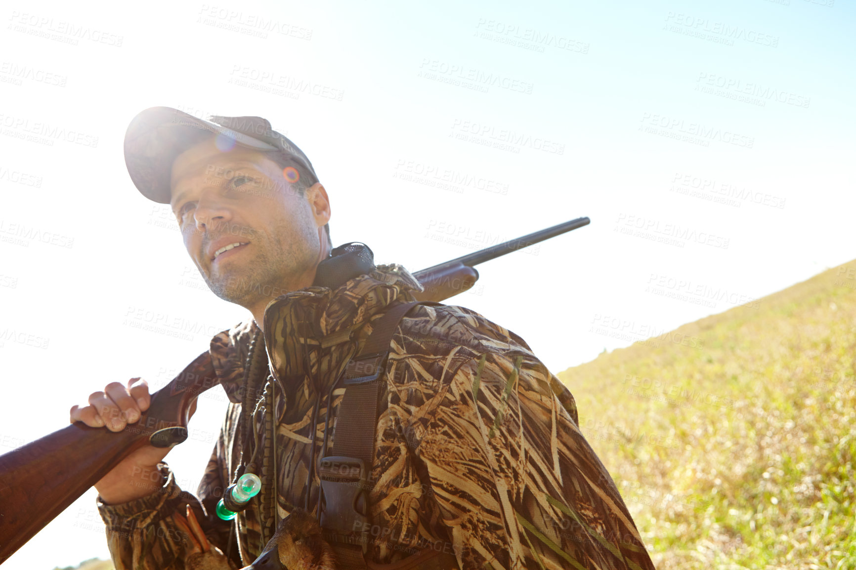 Buy stock photo Man, hunter and rifle in outdoor for sport, activity and trophy as wildlife enthusiast. Male person, shotgun and bait for recreation, adventure or camouflage with travel, survival or country for fun