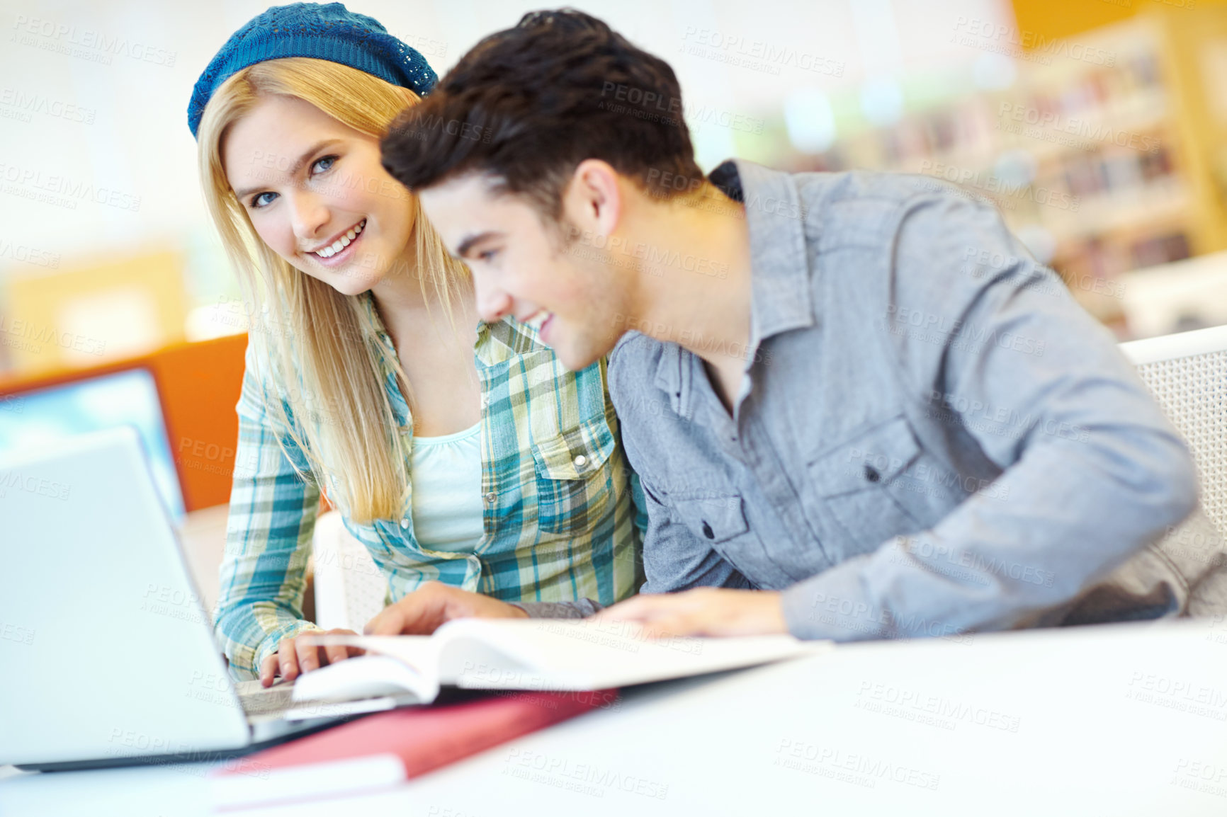 Buy stock photo Education, laptop and smile with couple of friends in library at college or university campus for learning. Computer, research and study with happy students at school desk for scholarship together