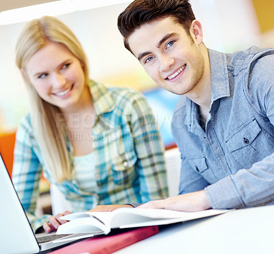 Buy stock photo Laptop, notebook and smile of student friends in library at college or university campus for learning. Computer, education and development with happy people at school desk for scholarship together