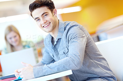 Buy stock photo Education, portrait and man in library for studying, learning or notebook at table. Male student, happy or information in college for exam preparation, understanding or research subject for knowledge