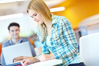 Buy stock photo Education, problem solving and reading with student woman in library at college or university campus for learning. Development, information and study with person at school desk for scholarship