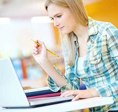 Buy stock photo Girl, university student and reading with laptop at library for research, learning and education. Person, woman and computer at college, campus and books for info, scholarship and study in Germany