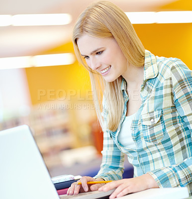 Buy stock photo Girl, college student and reading with laptop for education at library, learning and research. Person, woman and computer at university, campus and happy for info, scholarship and study in Germany