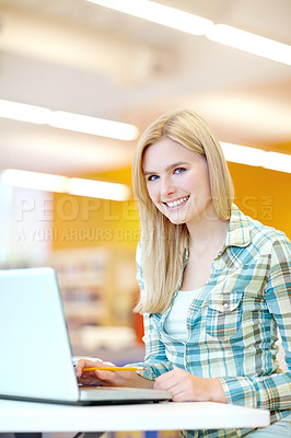 Buy stock photo Student, portrait and laptop on desk in classroom for study group, project or assignment. Female person, smile and technology for education, course or learning in college, campus or university in UK