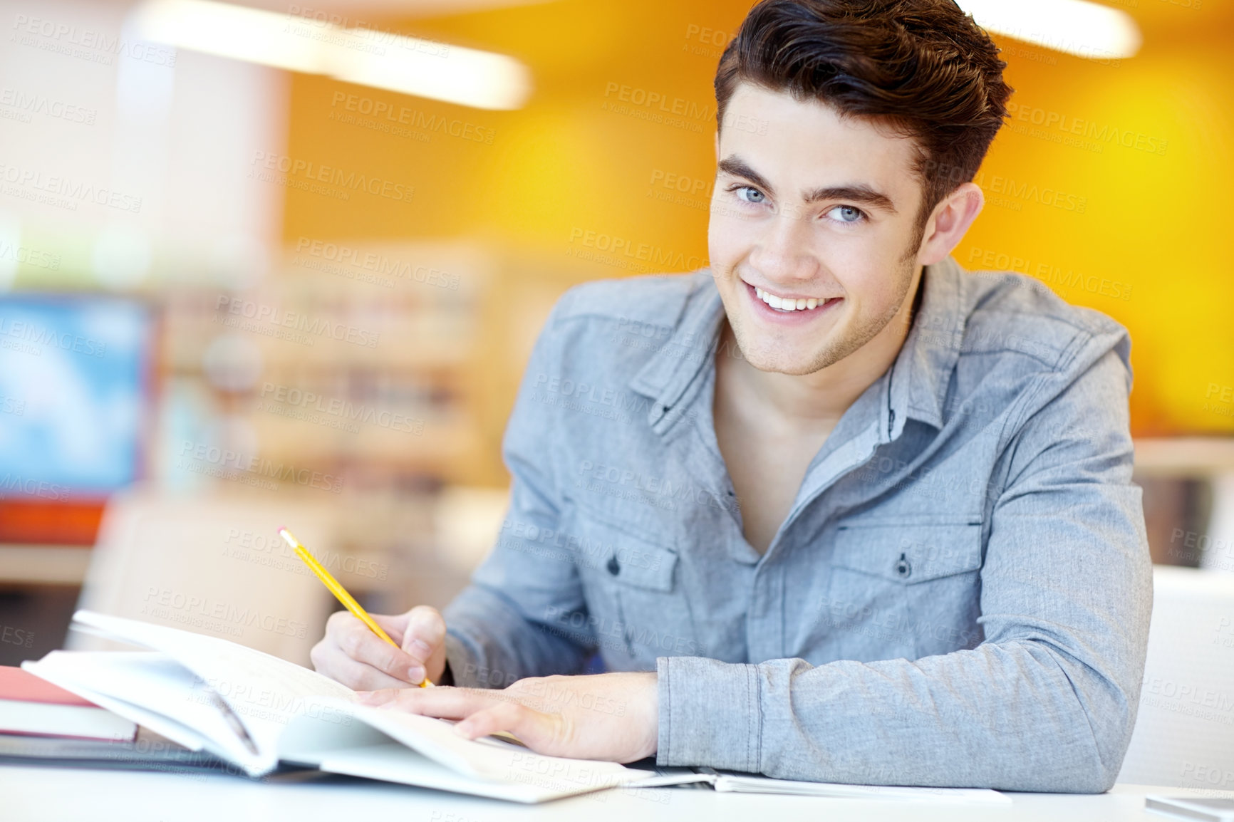 Buy stock photo Studying, book and man in library for portrait, writing and education at table. Male student, notebook and information in college for exam preparation, understanding or research subject for knowledge