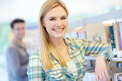 Buy stock photo Portrait, student and woman in library, smile and college with knowledge, scholarship and studying. Face, person or girl with higher education, university or learning with happiness, pride or academy