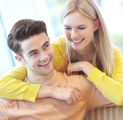 Buy stock photo Love, hug and happy couple in home for support, connection or laugh together to relax. Smile, man and woman embrace in living room for healthy relationship, trust or commitment to partner for loyalty