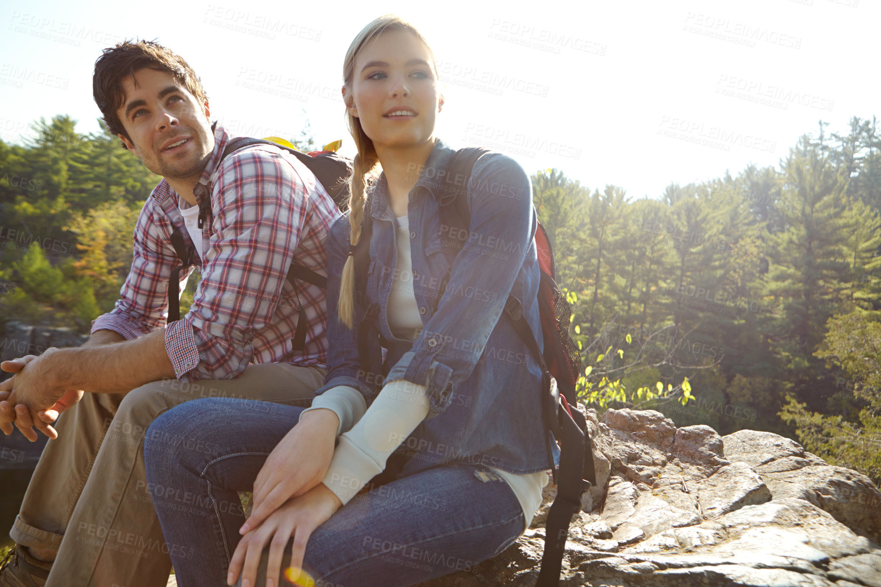 Buy stock photo Break, thinking or couple hiking in forest for travel, outdoor adventure or journey in nature together. Hikers, woods and people resting to relax on holiday vacation or trip to explore park for view