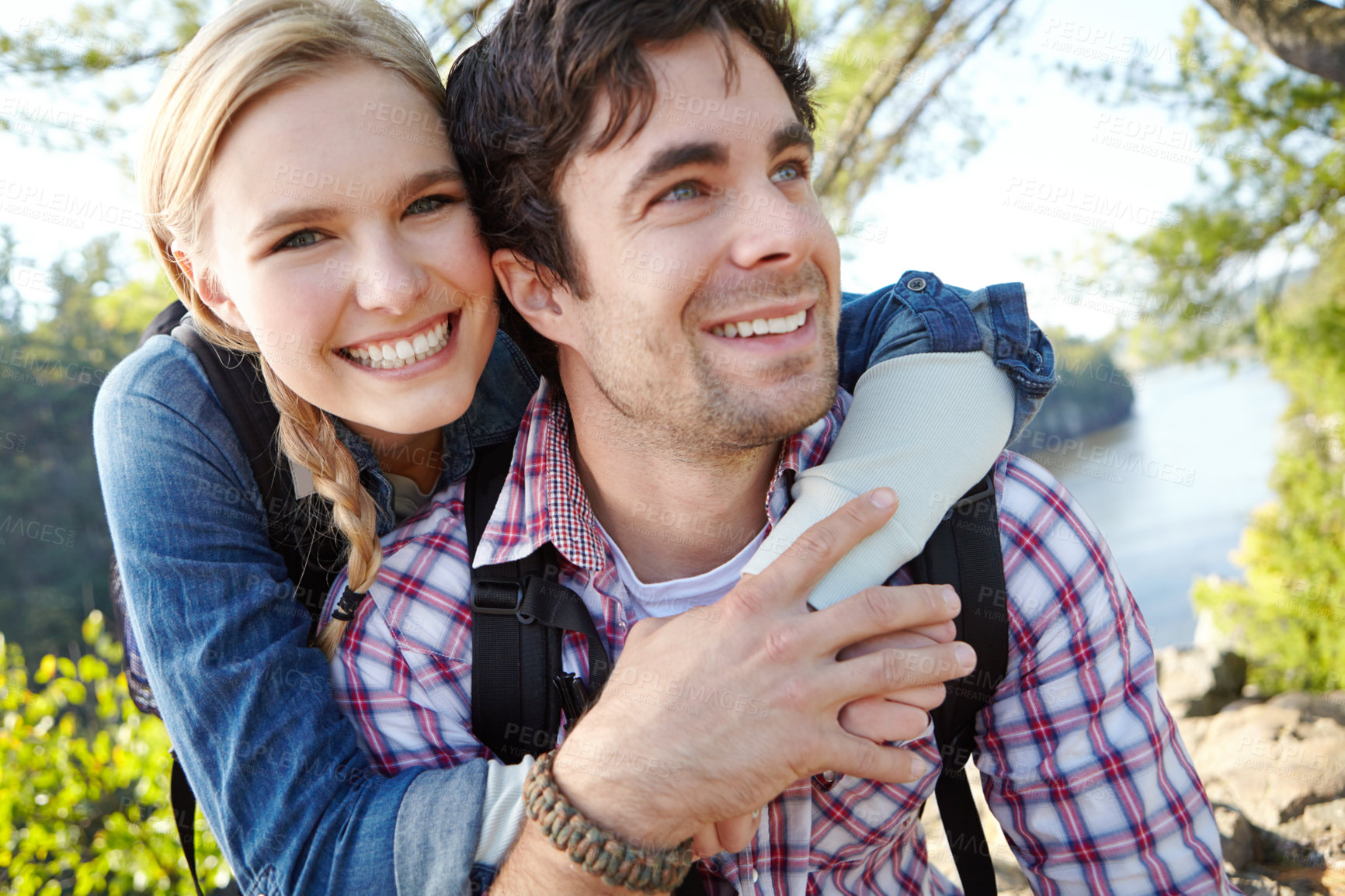 Buy stock photo Portrait, hug and couple hiking in forest for travel, outdoor adventure or journey in nature together. Romantic, woods or people resting to relax on holiday vacation or lake to explore park for break