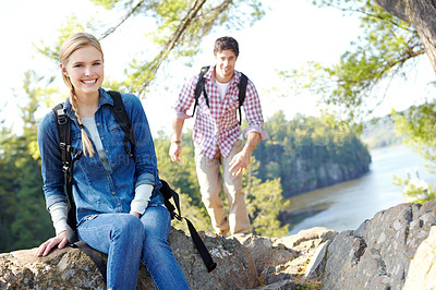 Buy stock photo Break, portrait or happy couple hiking by lake for travel, outdoor adventure or journey in nature with smile. Hikers, resting or people in forest on holiday vacation, trip or river to explore park