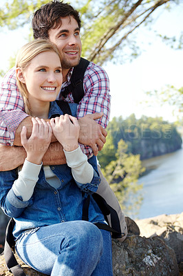 Buy stock photo View, hug or happy couple by river in woods for travel, outdoor adventure or hiking in nature together. Romantic, forest and people resting to relax on holiday vacation, break or trip to explore park