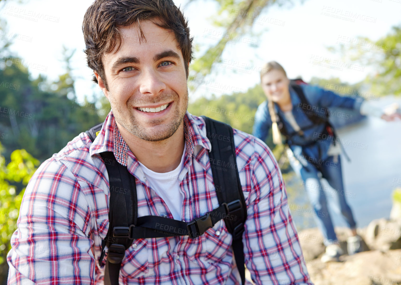 Buy stock photo Happy man, portrait or couple hiking in forest for travel, outdoor adventure or journey in woods. Mountain, hikers or people in nature together on holiday vacation, lake trip or break to explore park