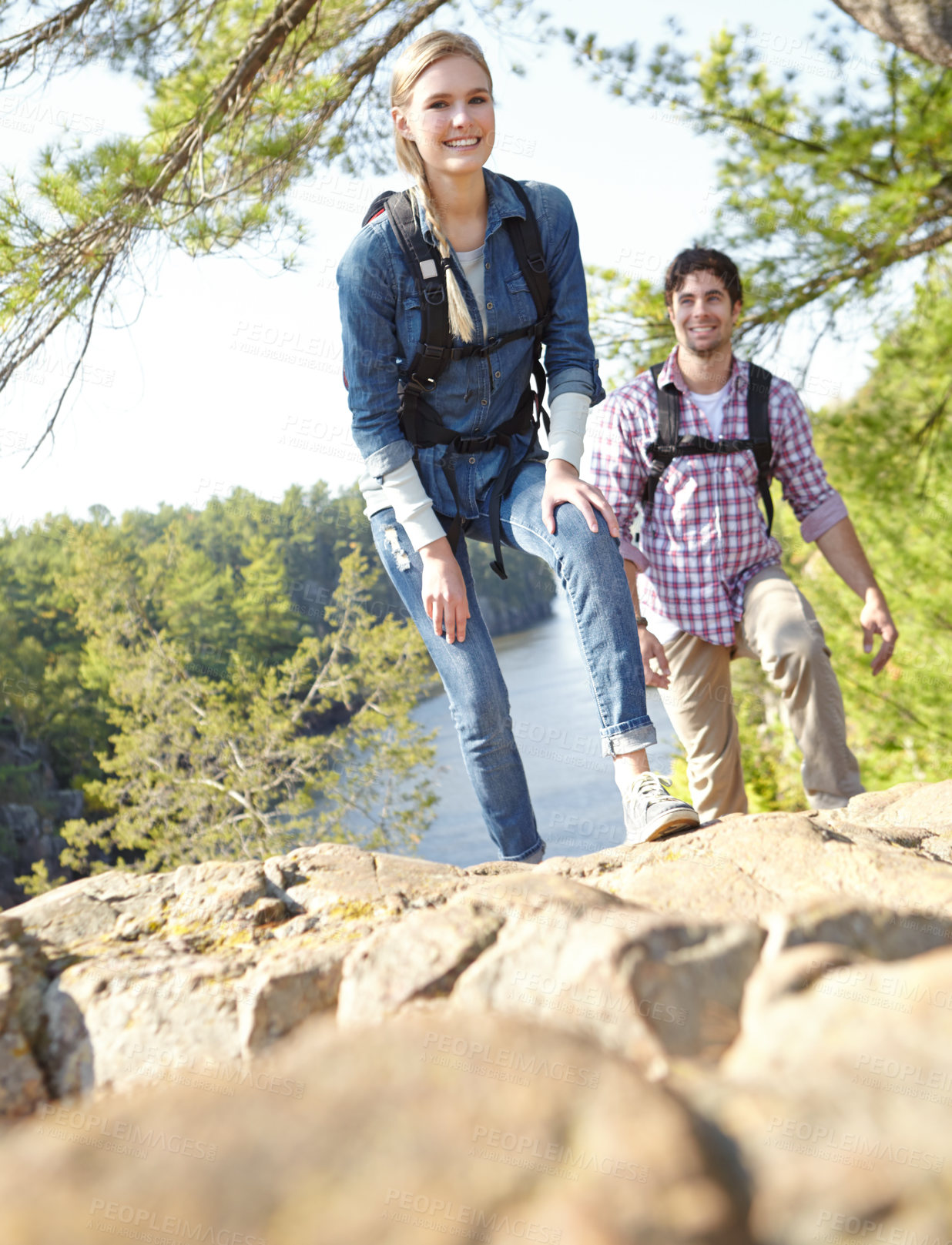 Buy stock photo Nature, couple and portrait with hiking by rock for outdoor adventure, travel and journey together. Happy, woman and man with backpack by mountain for trekking, exploration and tourism in Argentina