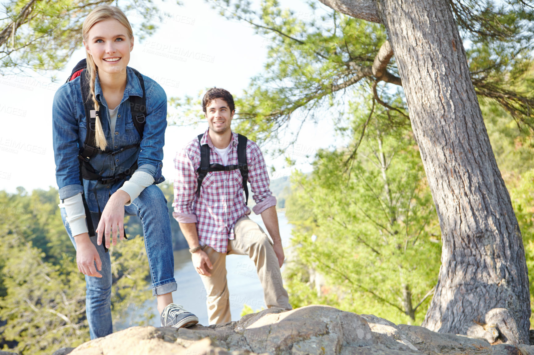 Buy stock photo Trees, nature and couple with smile in portrait for outdoor journey, travel and adventure together. Happy, woman and man with backpack on mountain for trekking, tourism and exploration in Argentina