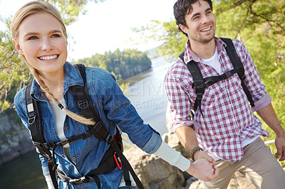 Buy stock photo Holding hands, forest or happy couple hiking by lake for travel, outdoor adventure or journey. River, woods or people in nature together on holiday vacation, mountain trip or break to explore park