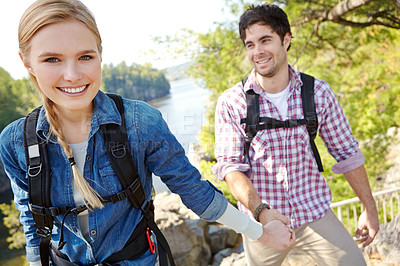 Buy stock photo Portrait, forest or happy couple holding hands by lake for travel, outdoor adventure or journey. River, woods or people in nature together on holiday vacation, mountain trip or break to explore park