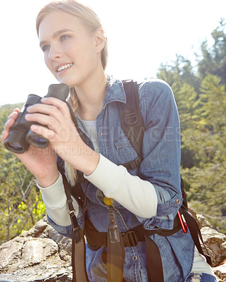 Buy stock photo Hiking, binoculars and explore with woman in nature for wildlife biologist, field research and ecology. Wellness, travel and adventure with person for environment study, conservation and outdoor