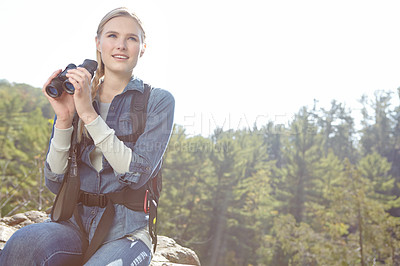 Buy stock photo Hiking, binoculars and search with woman in nature for wildlife biologist, field research and ecology. Wellness, travel and adventure with person for environment study, conservation and relax