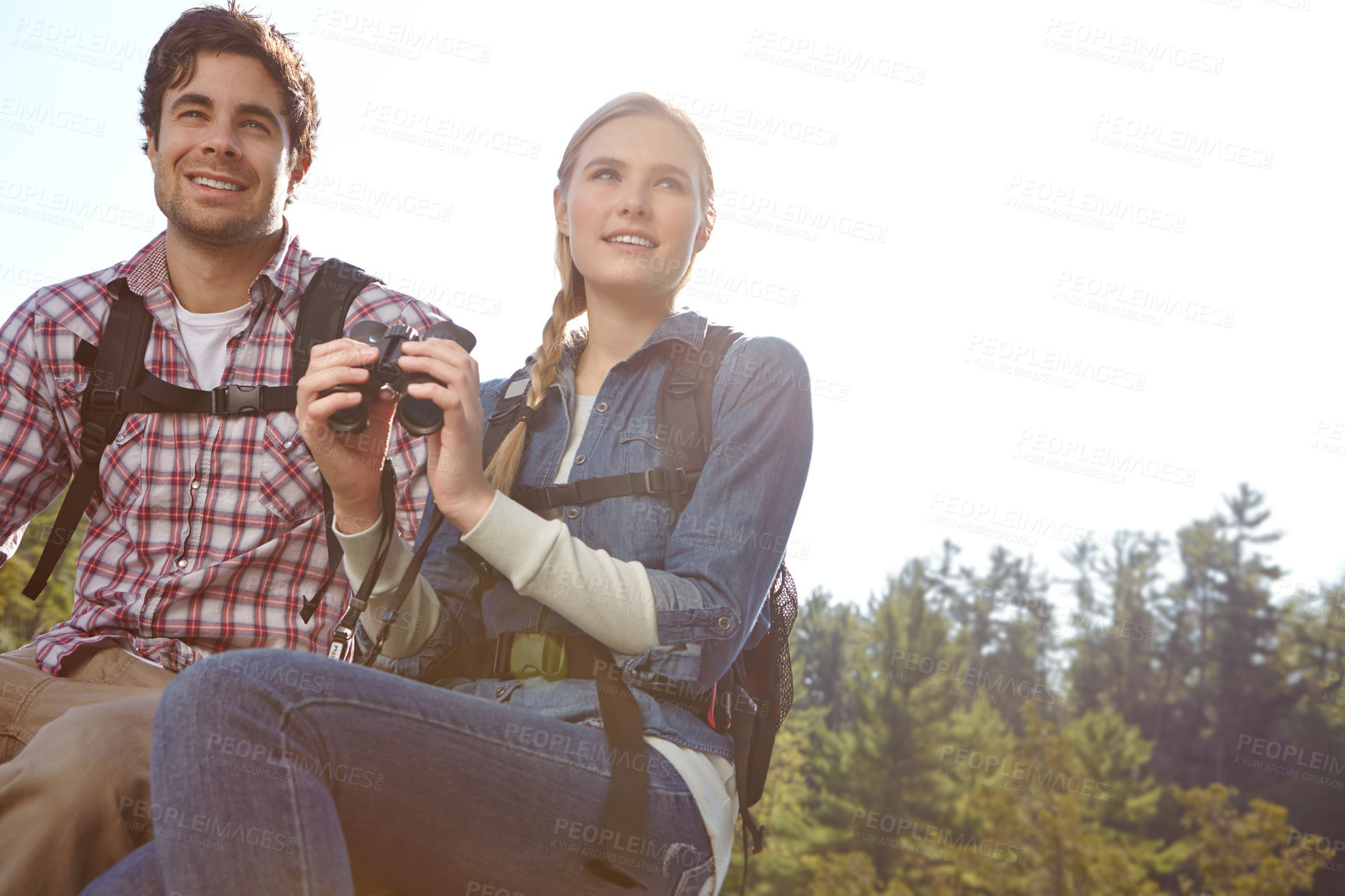 Buy stock photo View, binocular or happy couple hiking in forest for travel, outdoor adventure or journey in woods. Mountain, relax or people sightseeing in nature on holiday vacation, lake or break to explore park