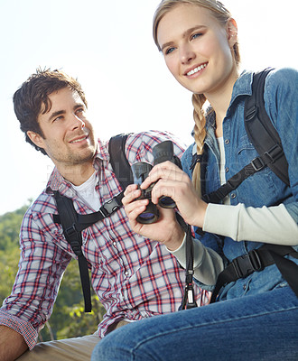 Buy stock photo Nature, binocular or happy couple hiking in mountain for travel or outdoor adventure in woods forest. Bonding, view or people sightseeing together on holiday vacation, trip or break to explore park