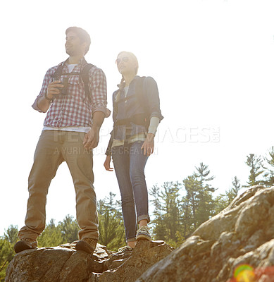 Buy stock photo Peak, binocular or couple hiking on rock or mountain for nature or outdoor adventure in woods. Forest, view or people on hill sightseeing together on holiday vacation, trip or break to explore park