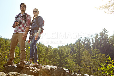 Buy stock photo View, binocular or couple hiking on peak or mountain for nature or outdoor adventure in woods. Forest, rock or people on hill sightseeing together on holiday vacation, trip or break to explore park