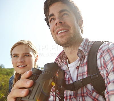 Buy stock photo Watching, binocular or happy couple in woods or mountain for travel and outdoor adventure in park. View, hiking or people sightseeing together on holiday vacation, trip or break to explore forest