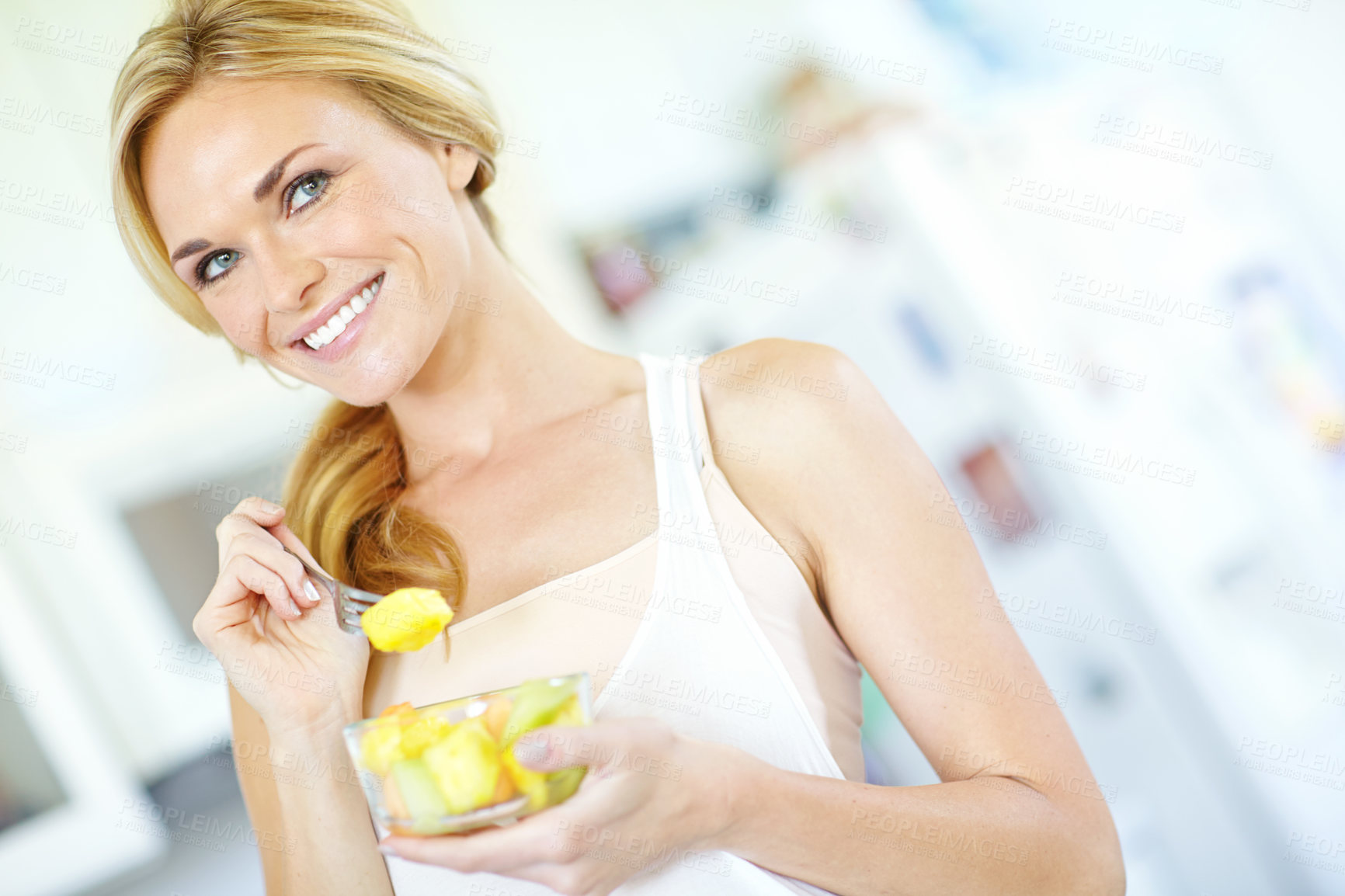 Buy stock photo Woman thinking, diet and fruit salad in kitchen with smile, healthy breakfast or energy for vitamins. Home, Australia and happy person eating organic food for wellness, benefits or vegan nutrition