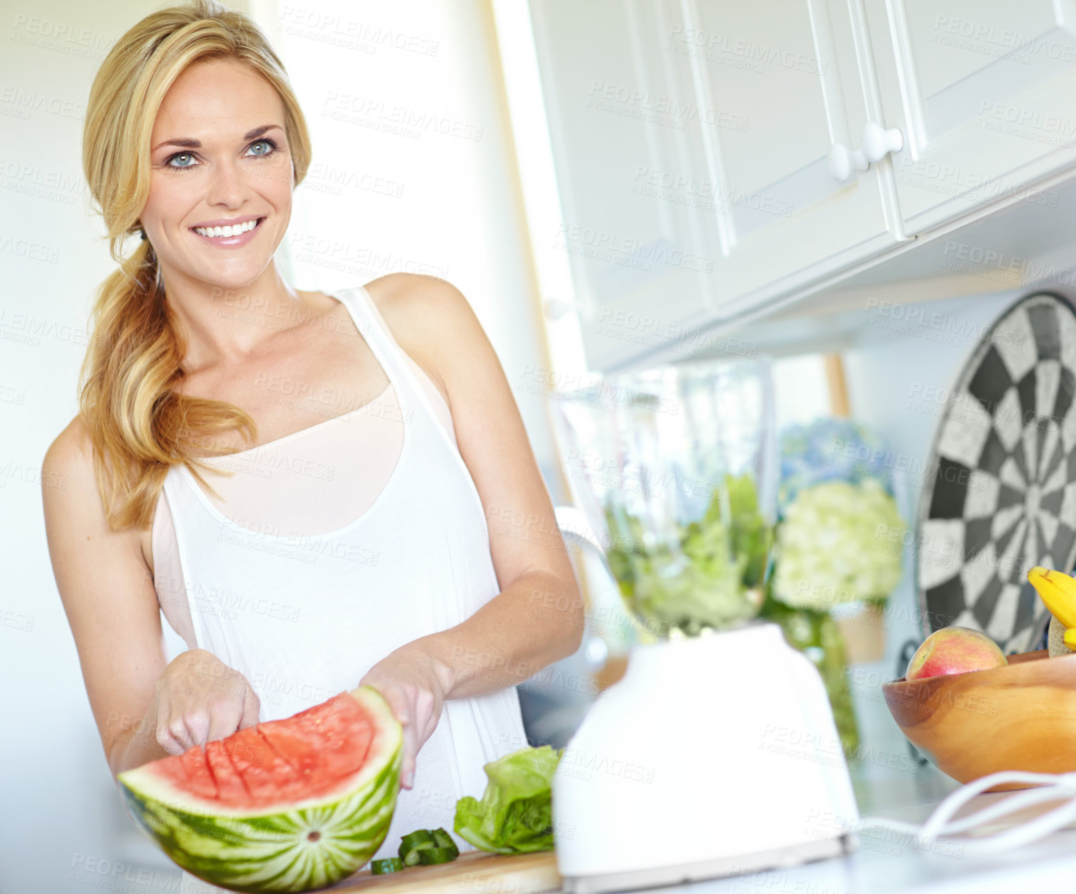 Buy stock photo Watermelon, smoothie and woman in kitchen with smile, breakfast energy or food for gut health. Drink, nutrition and girl in home with fruit, blender and diet for digestion, weight loss or juice detox