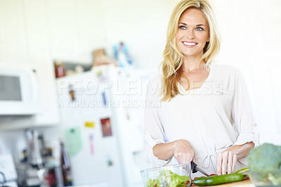 Buy stock photo Vegetables, thinking and woman in kitchen with smile, lunch and food for gut health, digestion and weight loss. Green salad, nutrition and girl in home with cooking, meal prep and wellness with diet