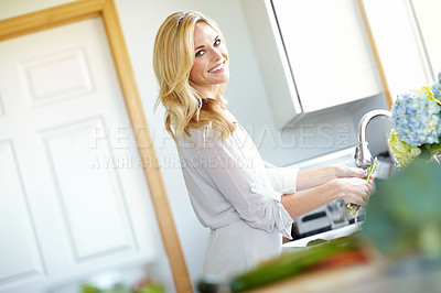 Buy stock photo Woman, happy portrait and washing vegetables in kitchen with smile, in morning in holiday and beach house. Relax, smile and cleaning for hygiene, breakfast and cooking for food and meal with flowers 