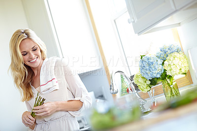 Buy stock photo Smile, cooking and woman with asparagus in kitchen for healthy diet, nutrition or planning meal prep. Happy person, vegetables and vegan with natural food for benefits, vitamin c and organic in home