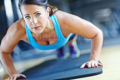 Buy stock photo Fitness, push up and woman in gym for exercise, workout and training for performance or endurance. Sports, serious and person on floor for strong, wellness or health for strength, muscle and active