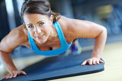 Buy stock photo Fitness, push up and portrait of woman in gym for exercise, workout or training for performance. Sports, endurance and person on floor for strong, wellness or health for strength, muscle or challenge