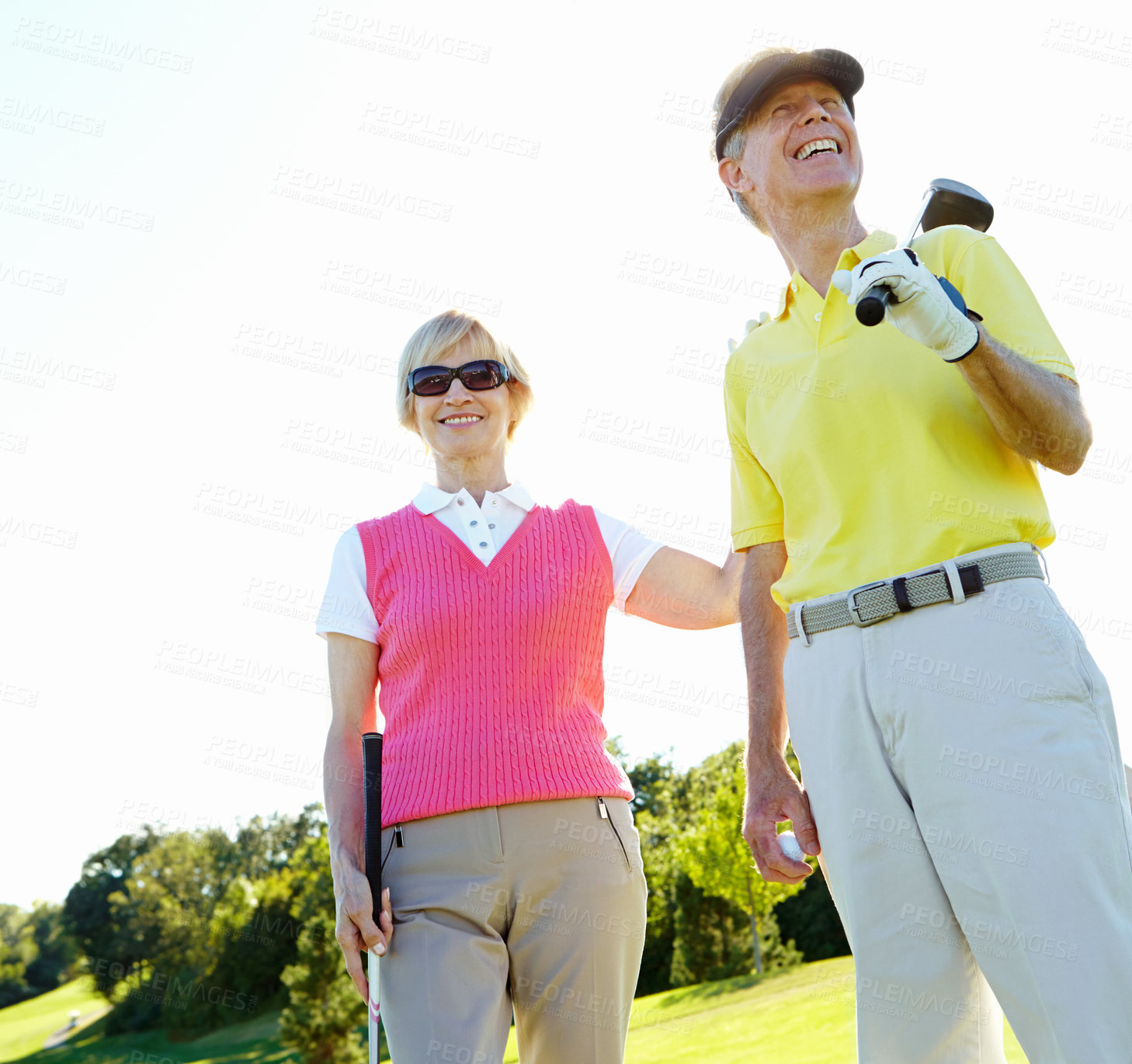 Buy stock photo Senior, happy couple and golfers with club on grass field for fun activity, sports game or outdoor match together. Mature man and woman with smile in joy or enjoying golf, challenge or play in nature