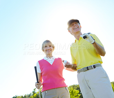 Buy stock photo Mature, happy couple and golfers with club on grass field for fun activity, sports game or outdoor match together. Senior man and woman with smile in joy or enjoying golf, challenge or play in nature