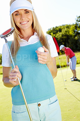 Buy stock photo Happy woman, portrait and club with golf ball for match, sports game or outdoor activity on grass field. Young female person, golfer or player with smile for competition, point or challenge on course