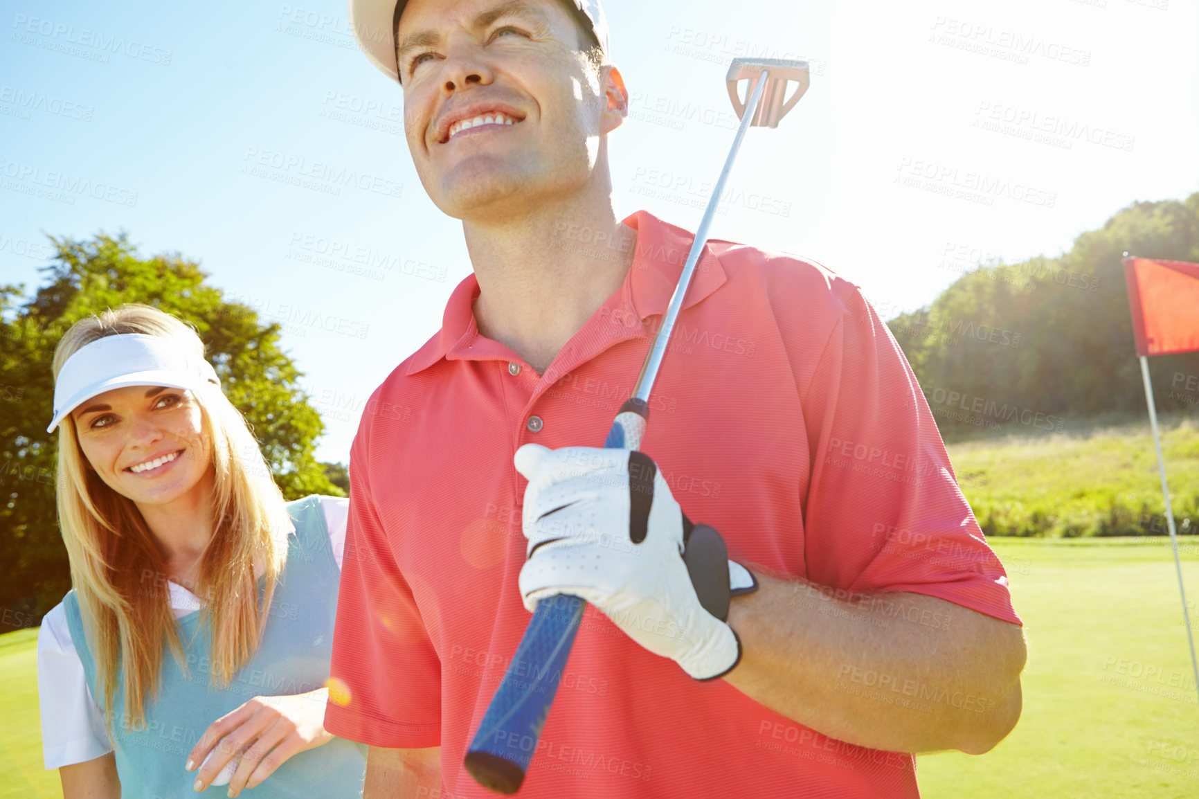 Buy stock photo Golf course, woman and man with smile, fun and outdoor game for fitness together in morning. Confidence, teamwork and happy couple on green for sports date, health and wellness with partnership.