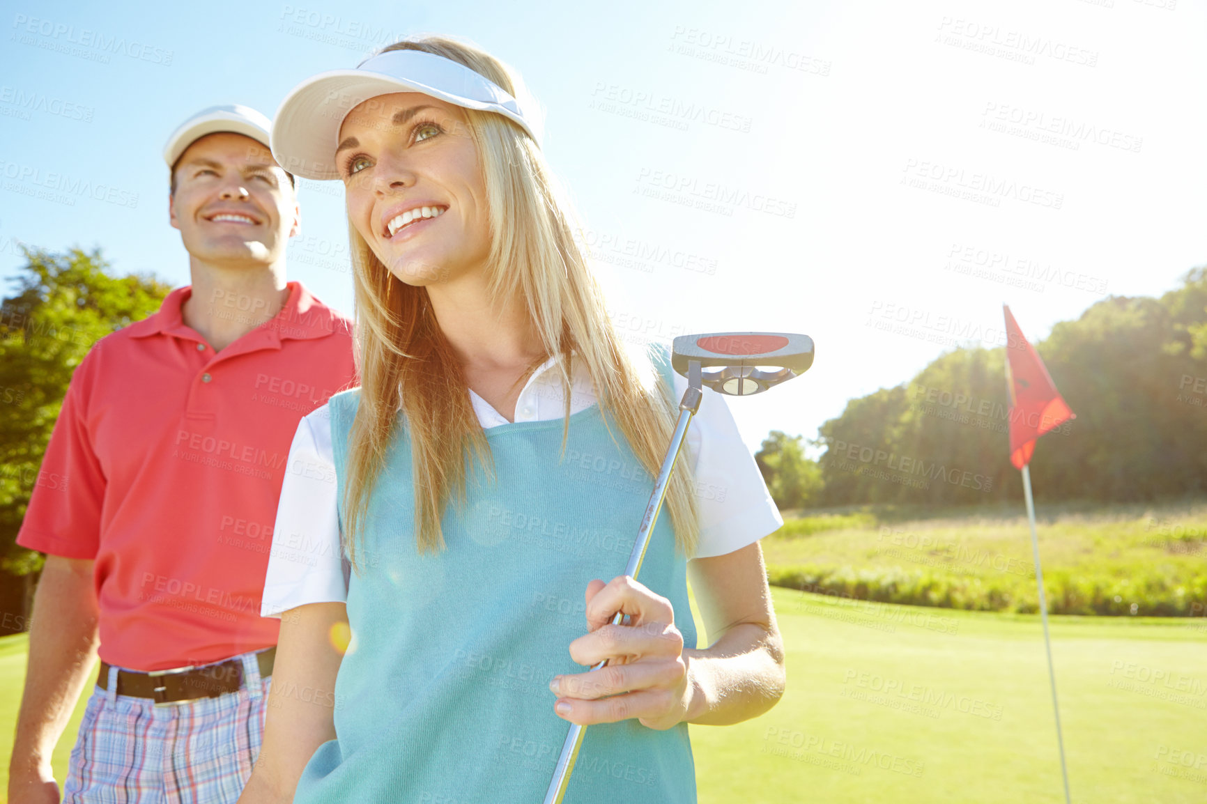 Buy stock photo Golf course, woman and happy couple with club for sport, game and thinking with putter equipment. Golfers, man and partner in nature for exercise, hobby and competition practice on grass with caddy