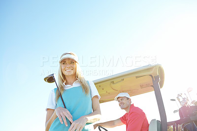 Buy stock photo Sky, woman and man with golf cart at club for outdoor fun, game and fitness on weekend morning together. Smile, teamwork and couple on green for sports, health and wellness in partnership on course.