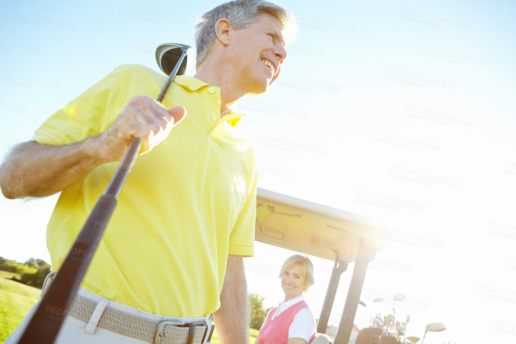 Buy stock photo Sports, golf course and mature man with club for game, match and competition on golfing field. Retirement, senior couple and person in morning with smile outdoors for training, hobby and practice