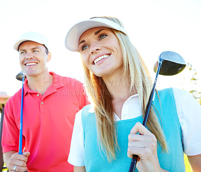 Buy stock photo Golf course, woman and happy couple with club outdoor for sport, game and thinking with driver. Golfers, man and partner smile in nature for exercise, training and competition practice for fitness