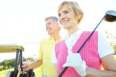 Buy stock photo Senior couple, outdoor and driver for golfing on course, retirement and bonding on holiday. People, cart and recreation activity for relationship connection, performance and support at driving range